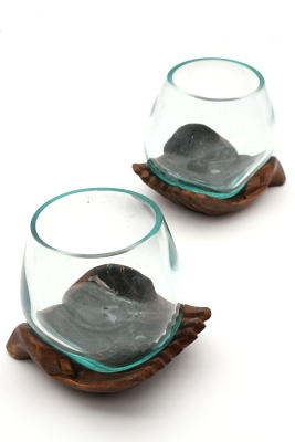 Decorative glass on carved wooden hand