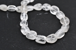 Bergkristall Trommelstein Strang